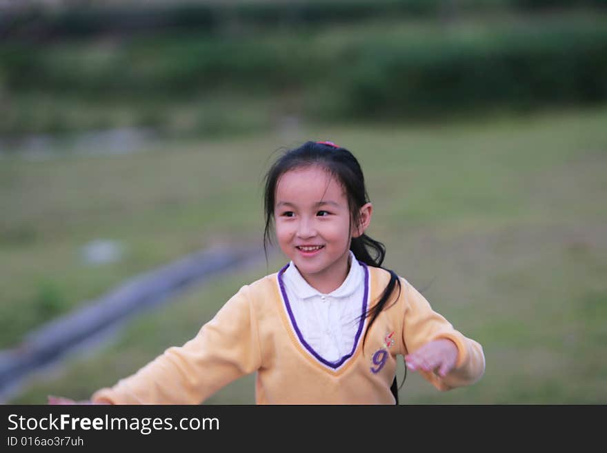 The asian  girl in a park . The asian  girl in a park .