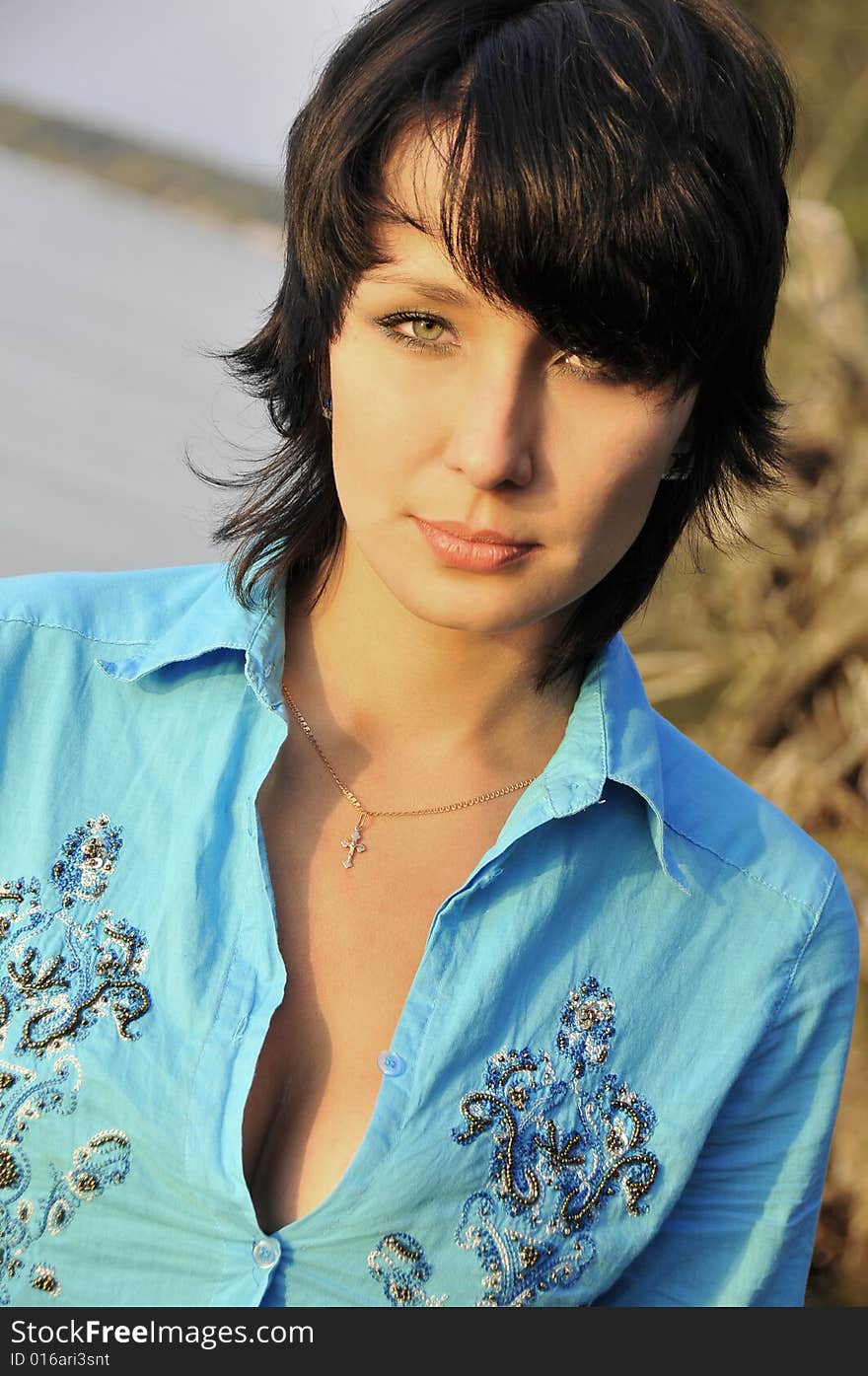 Portrait of beautiful girl on a background a sea. Portrait of beautiful girl on a background a sea