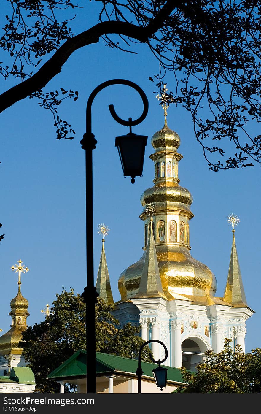 Golden church domes over blue sky background. Golden church domes over blue sky background