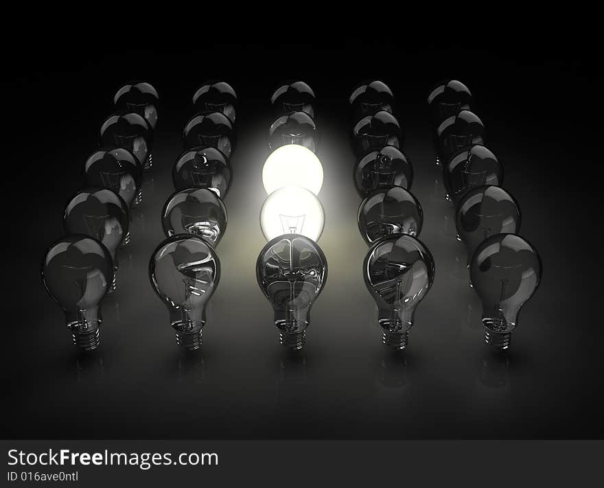 Group of light bulbs with one shining