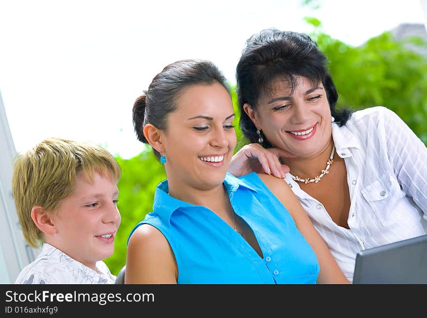 Portrait of happy family getting busy with laptop. Portrait of happy family getting busy with laptop