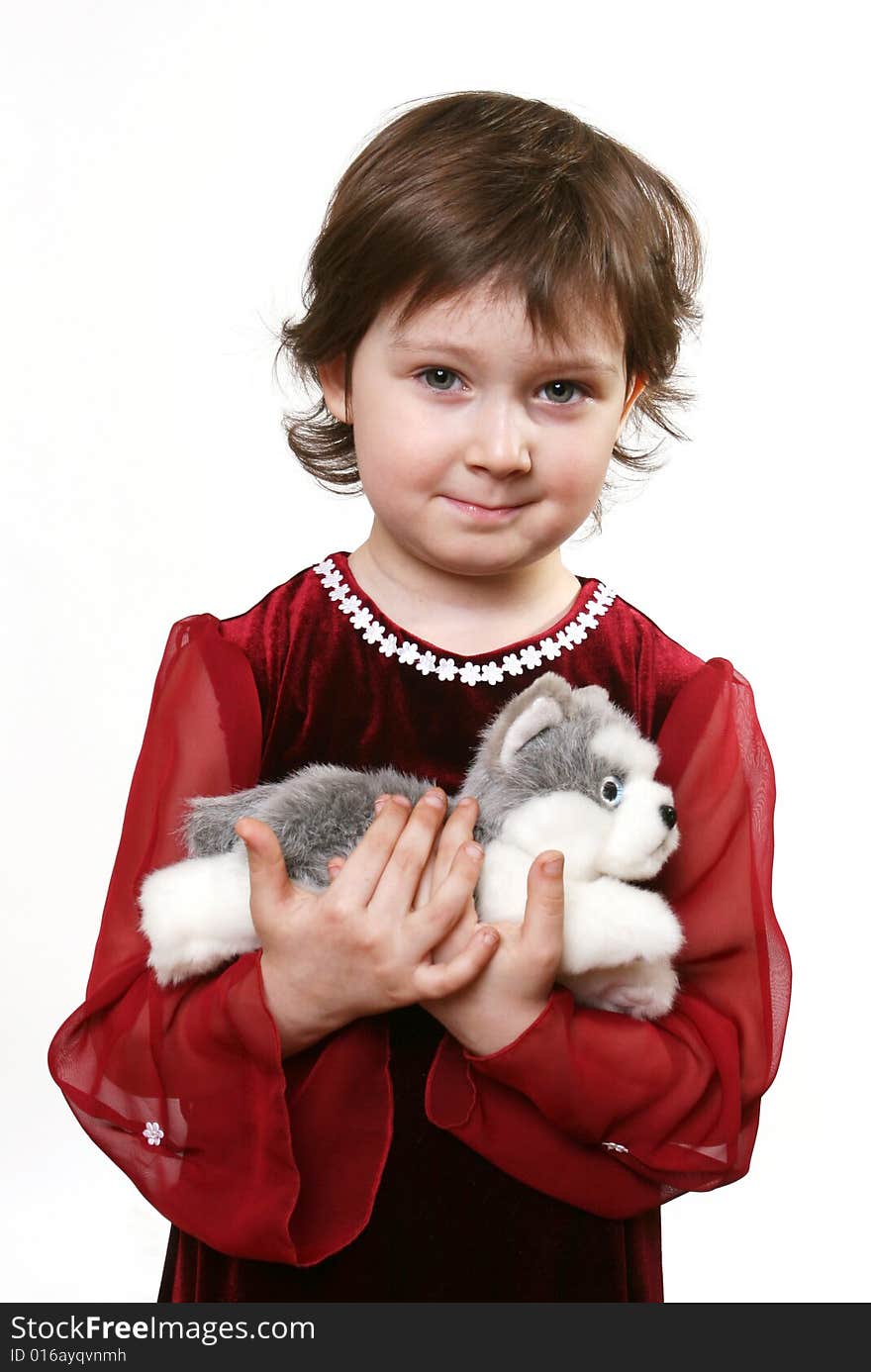 Little girl with toy puppy on white ground