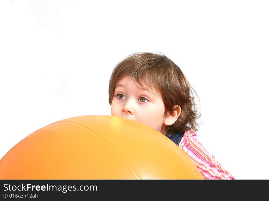 Little Girl Playing With Big Orange Ball