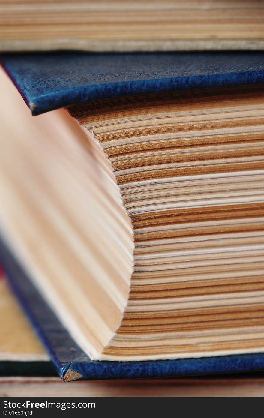 Big pile of old books. Close-up. Narrow depth of field.