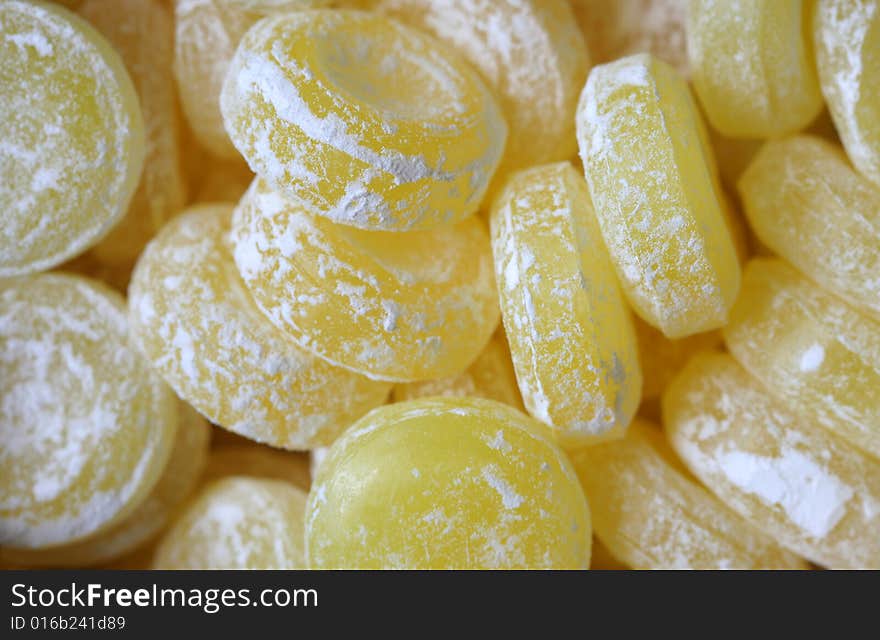 Sweet yellow candies - color background. Sweet yellow candies - color background