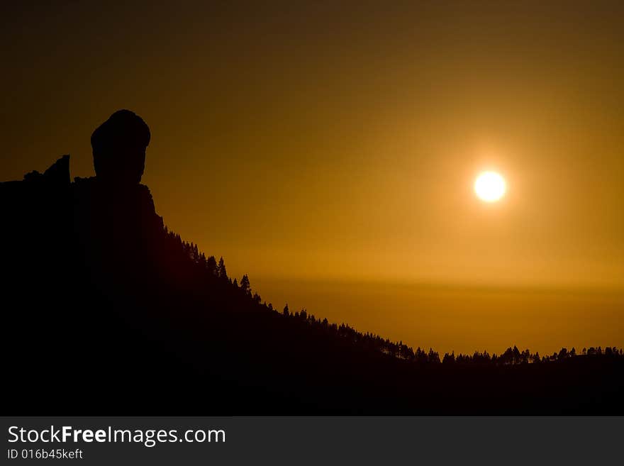 Orange sunset with mountain and pine forest. Orange sunset with mountain and pine forest