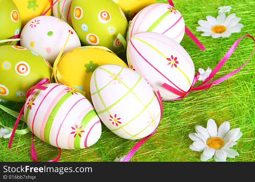 Painted Easter eggs on green