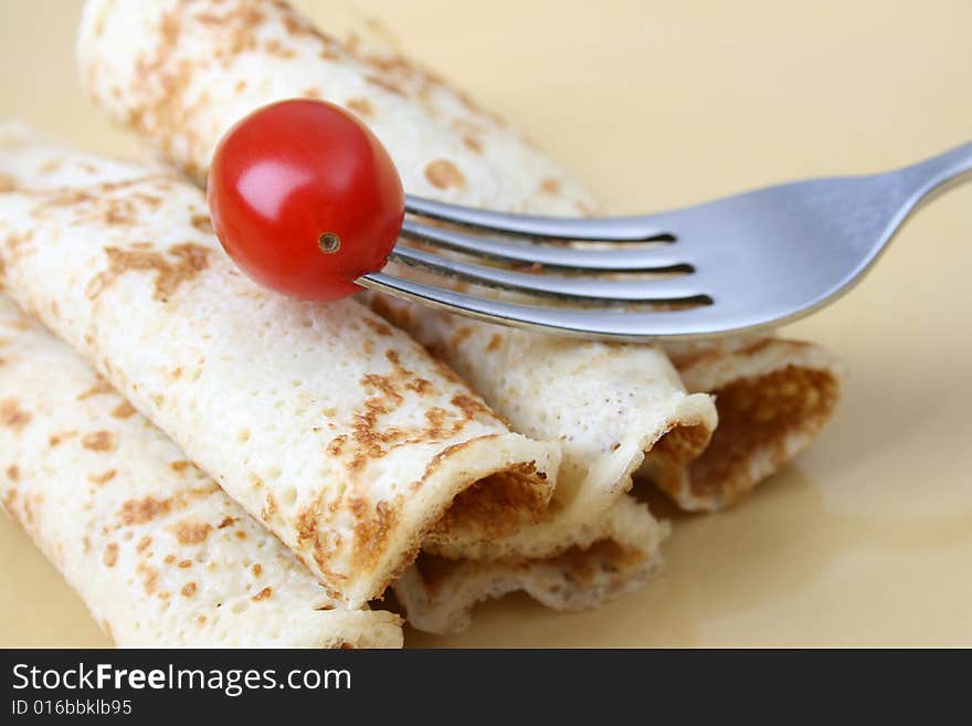 Close up of pancakes on a yellow plate. Close up of pancakes on a yellow plate