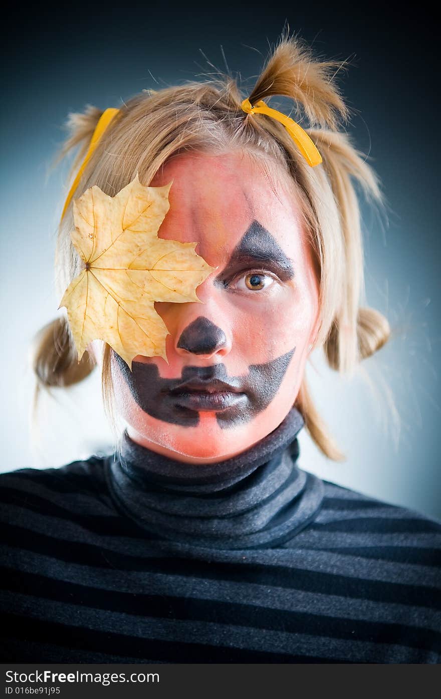 Jack-o-lantern girl with leaf on face