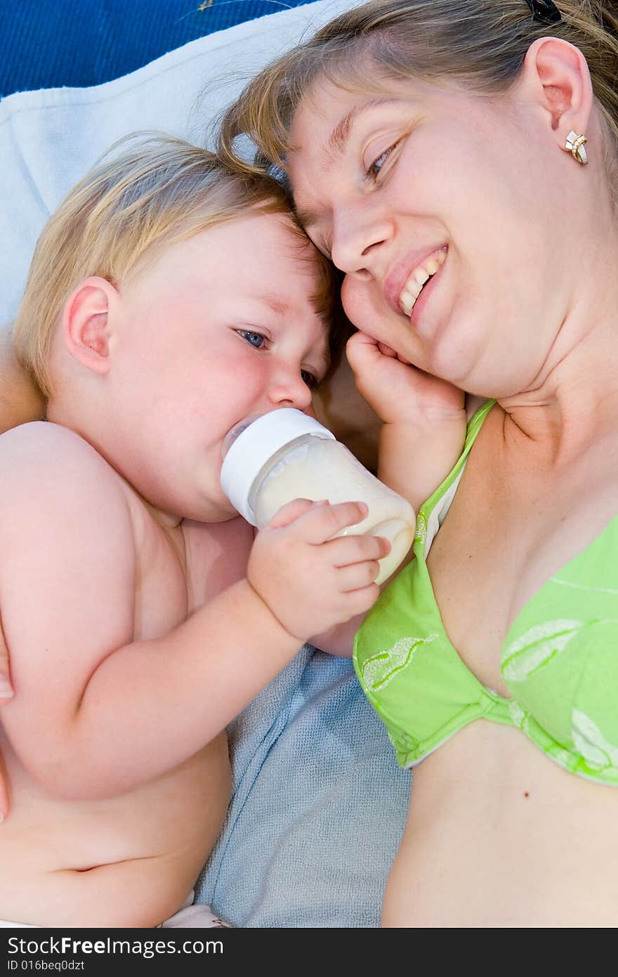 Woman and the child drinking milk. Woman and the child drinking milk