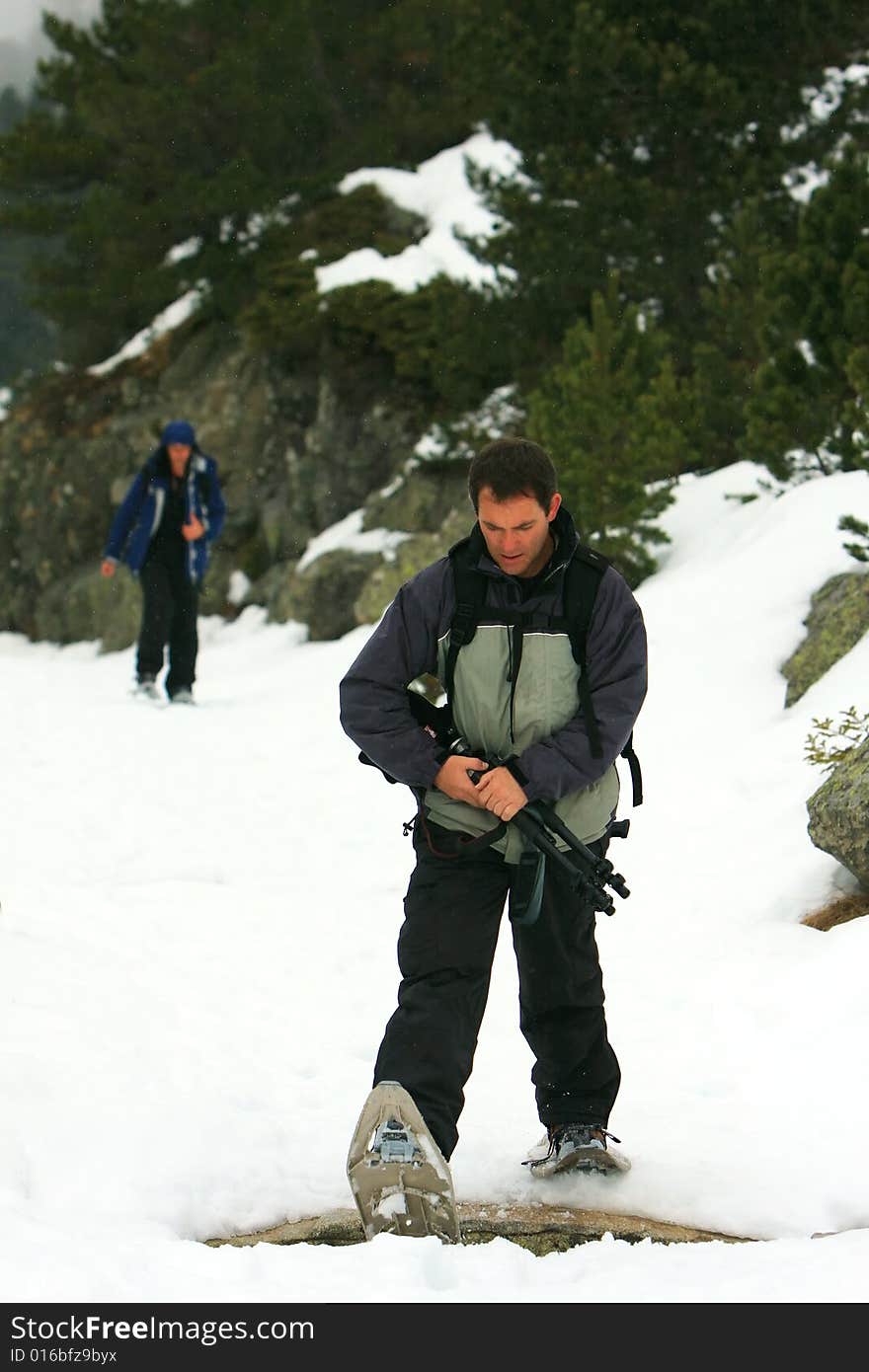 Hikers On A Snowy Mountain