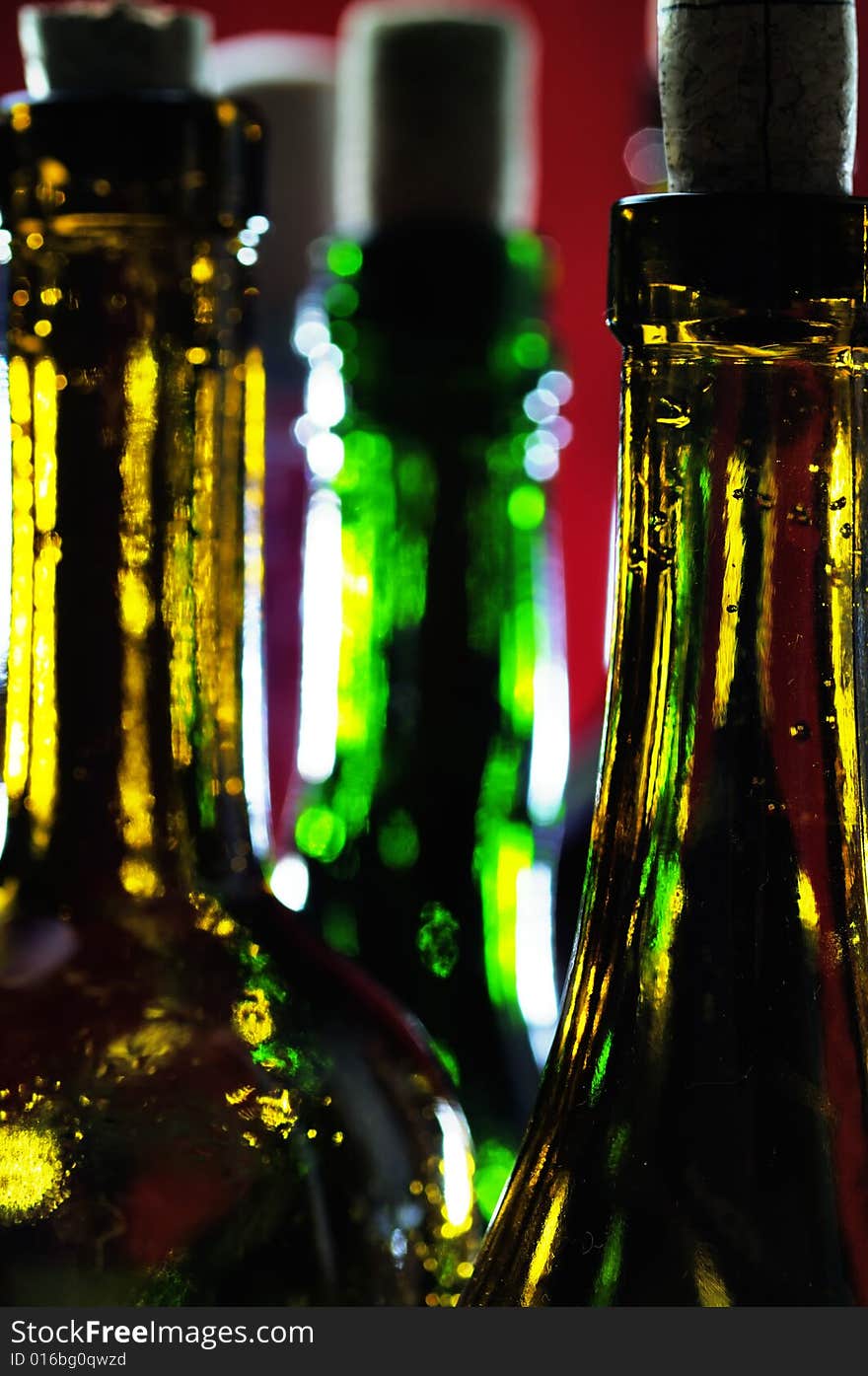 Bottles on the red background. Narrow depth of field. Bottles on the red background. Narrow depth of field.