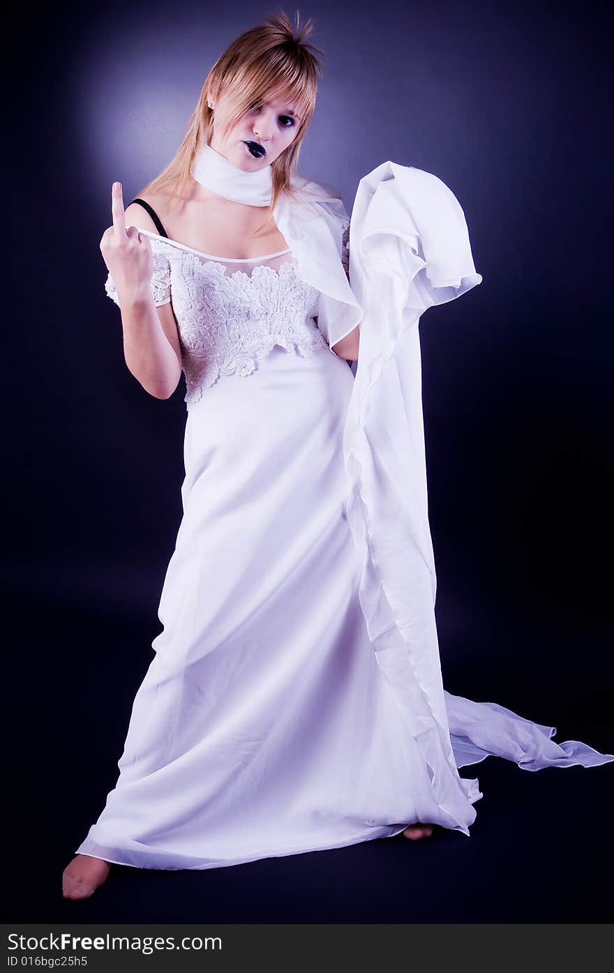 Young girl in wedding dress gesticulating, studio isolated