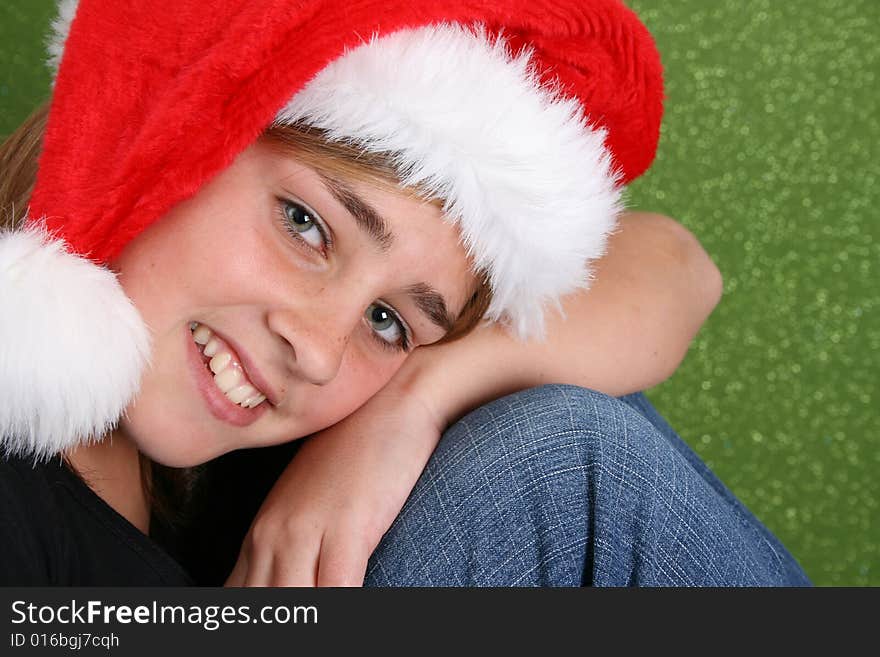 Beautiful teenager girl wearing a christmas hat. Beautiful teenager girl wearing a christmas hat