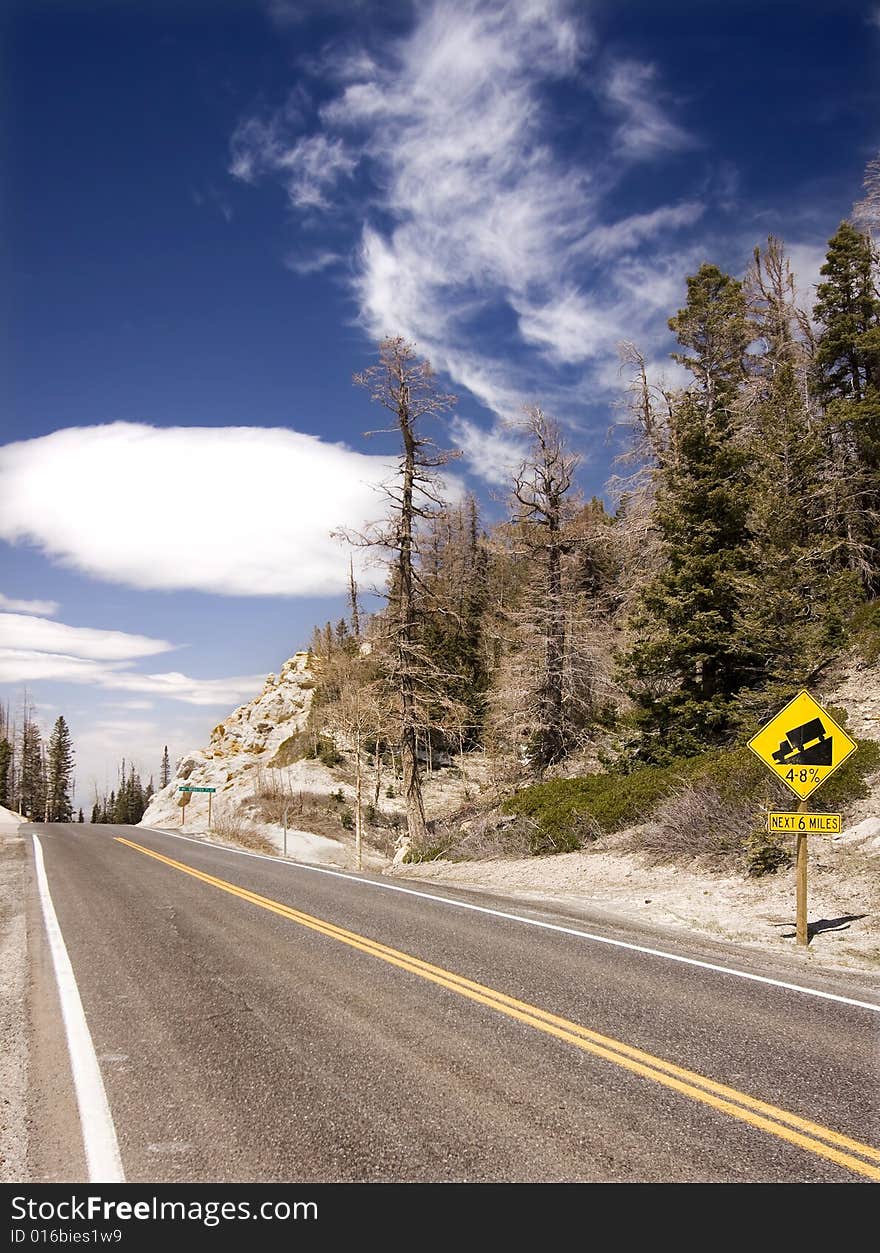 Mountain road with steep warning sign, Utah