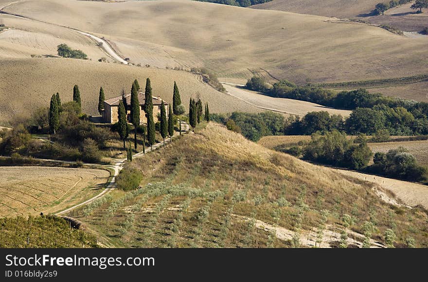 Tuscan landscape Valle d'Orcia, italy, isolated farm with cypress and hills. Tuscan landscape Valle d'Orcia, italy, isolated farm with cypress and hills