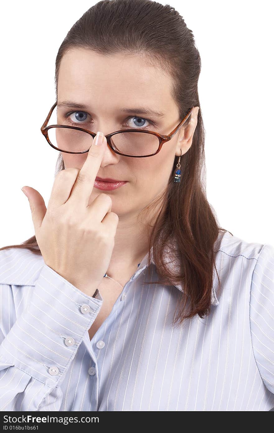 Beautiful brunette businesswoman wearing a blue shirt showing middle finger. Isolated on white background