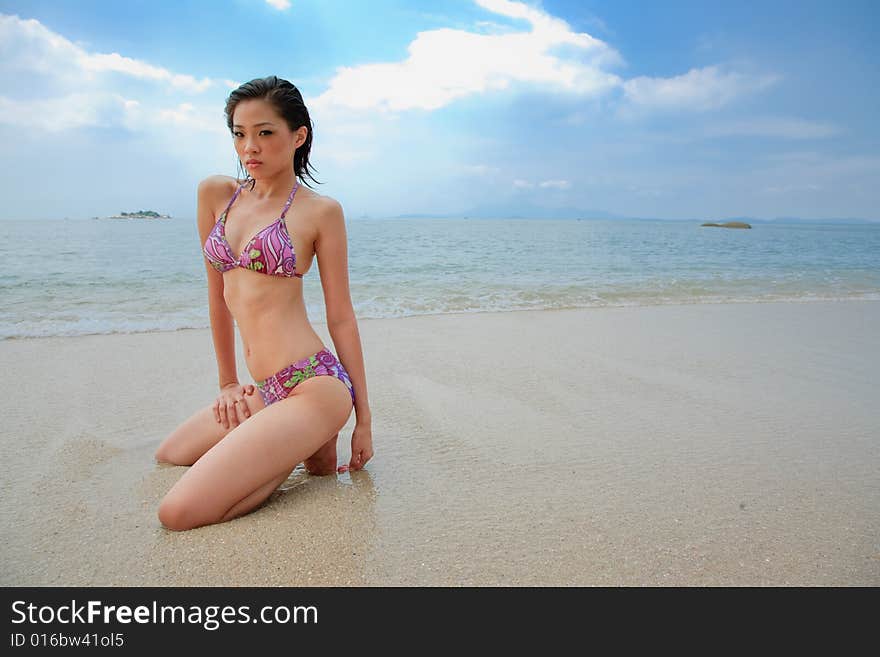 Asian young woman relaxing at the beach. Asian young woman relaxing at the beach