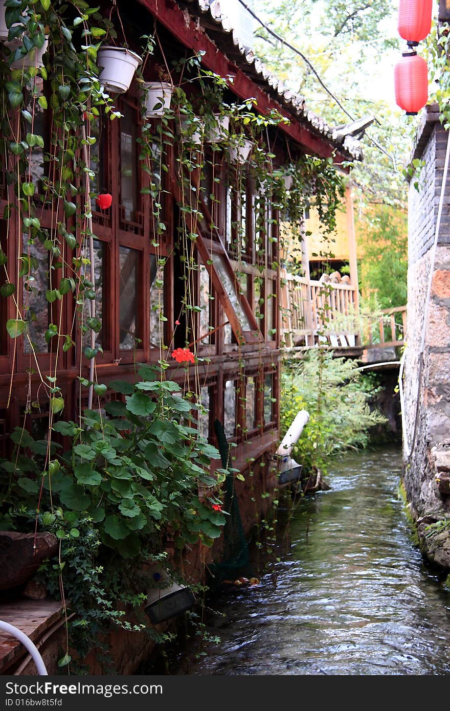 The Old Town of Lijiang is also known as Dayan Town in Lijiangba. Ancient building in Lijiang along side stream . The Old Town of Lijiang is also known as Dayan Town in Lijiangba. Ancient building in Lijiang along side stream .