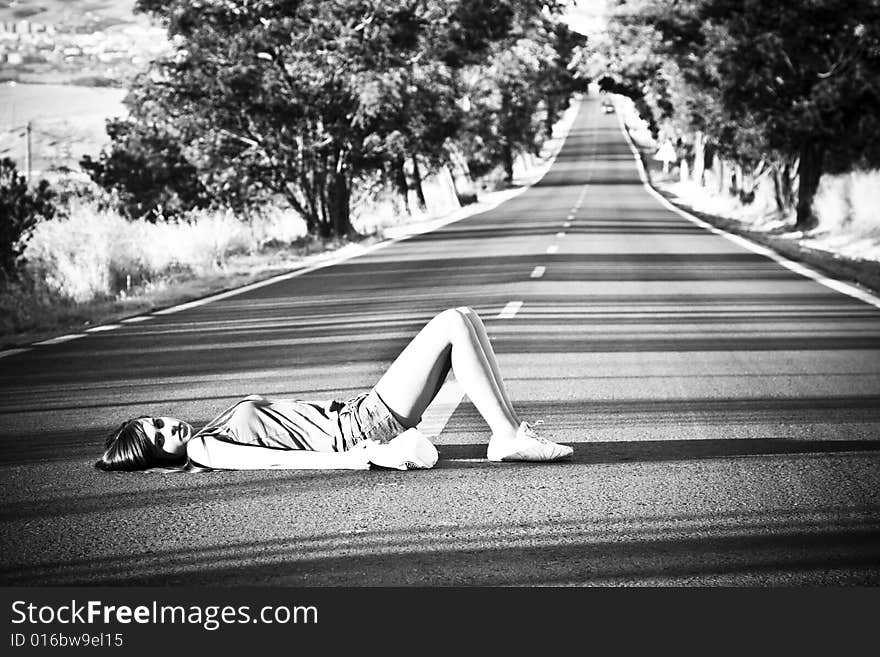 Girl laying on the road