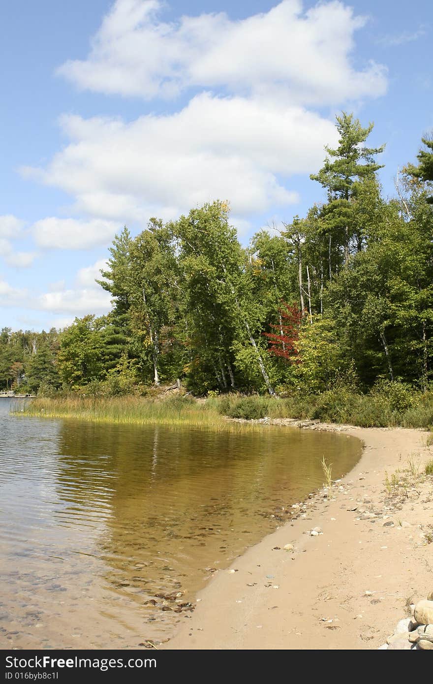 Michigan Upper Peninsula (UP) Northern Beach on Piatt Lake in Hiawatha National Forest September autumn day