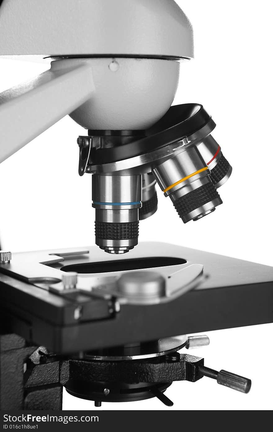 Microscope over white background