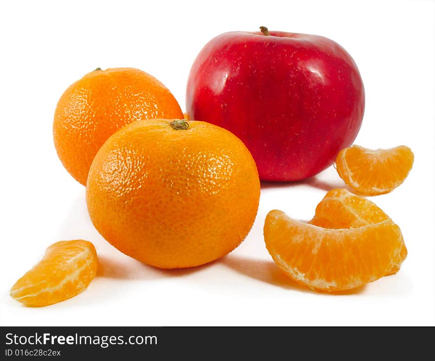 Mandarines and red apple on a white background. Mandarines and red apple on a white background