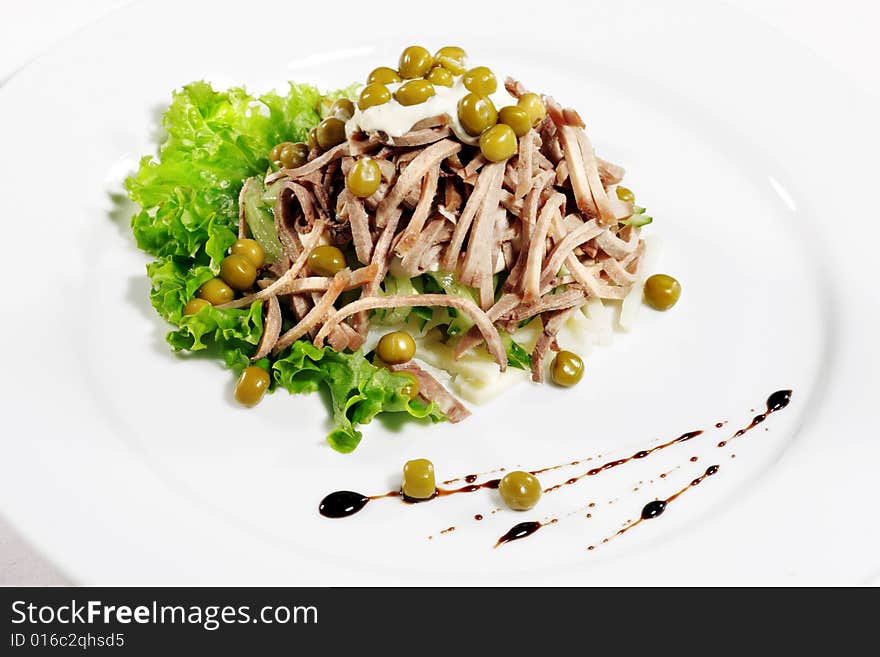 Green Peas and Meat Salad Served with Salad Leaves and Sauce. Isolated on White Background. Green Peas and Meat Salad Served with Salad Leaves and Sauce. Isolated on White Background