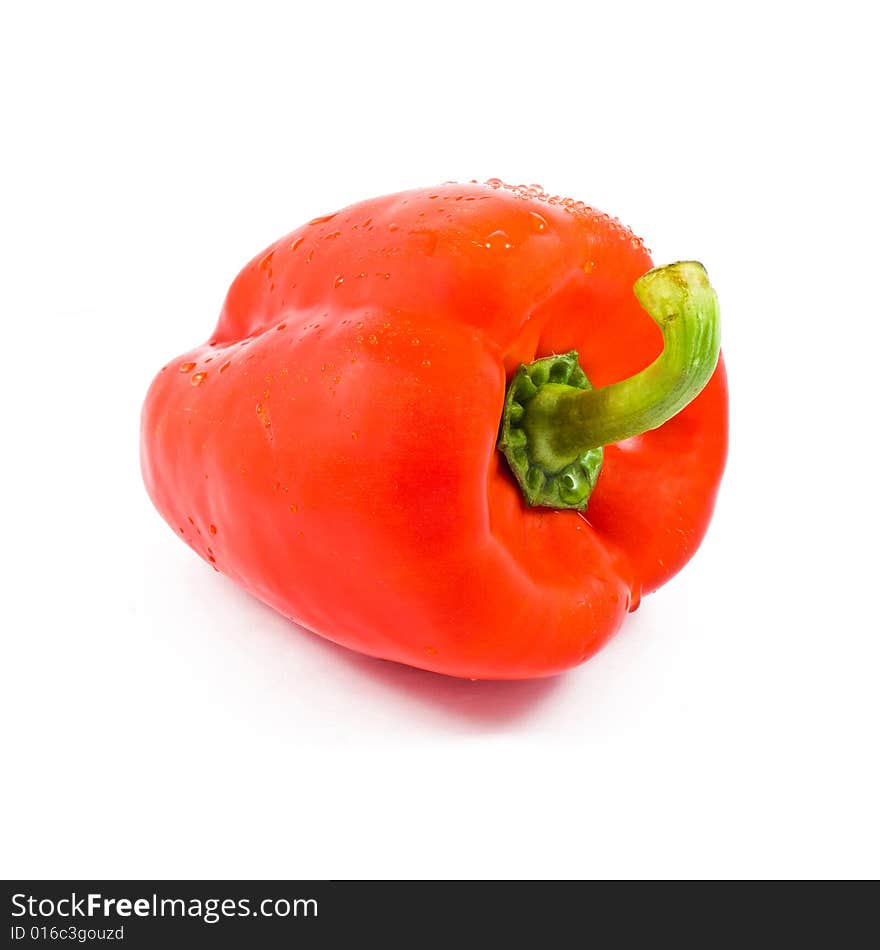 A red fresh pepper isolated on white. A red fresh pepper isolated on white