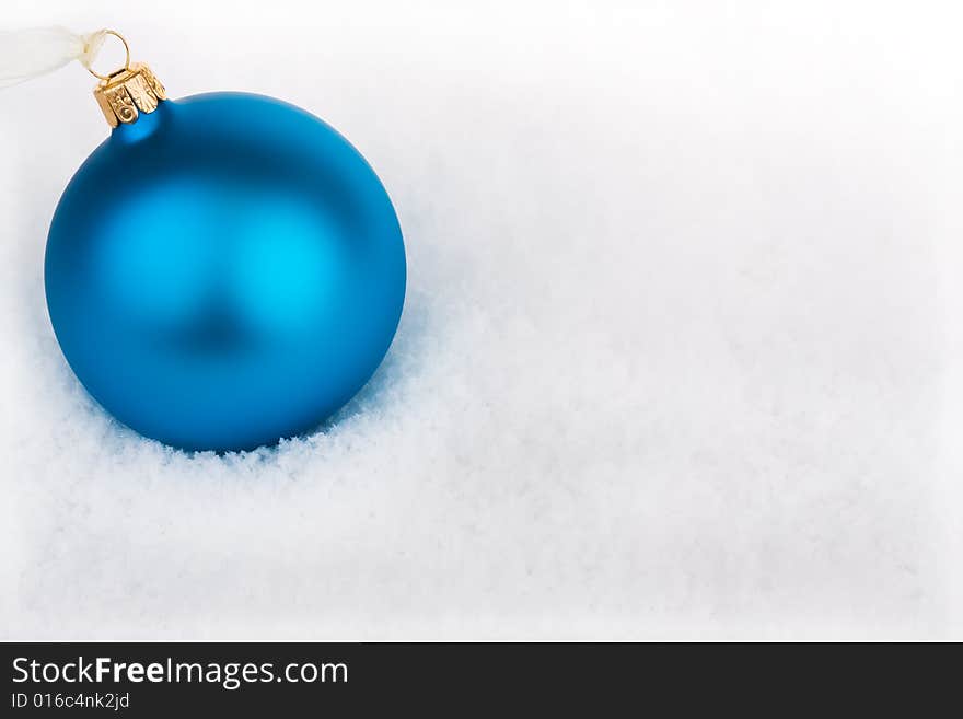 Cool blue Christmas baubles in the snow