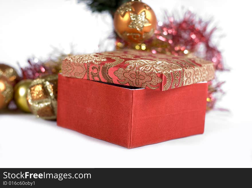 Present box under the Christmas tree isolated on a white background. Present box under the Christmas tree isolated on a white background.