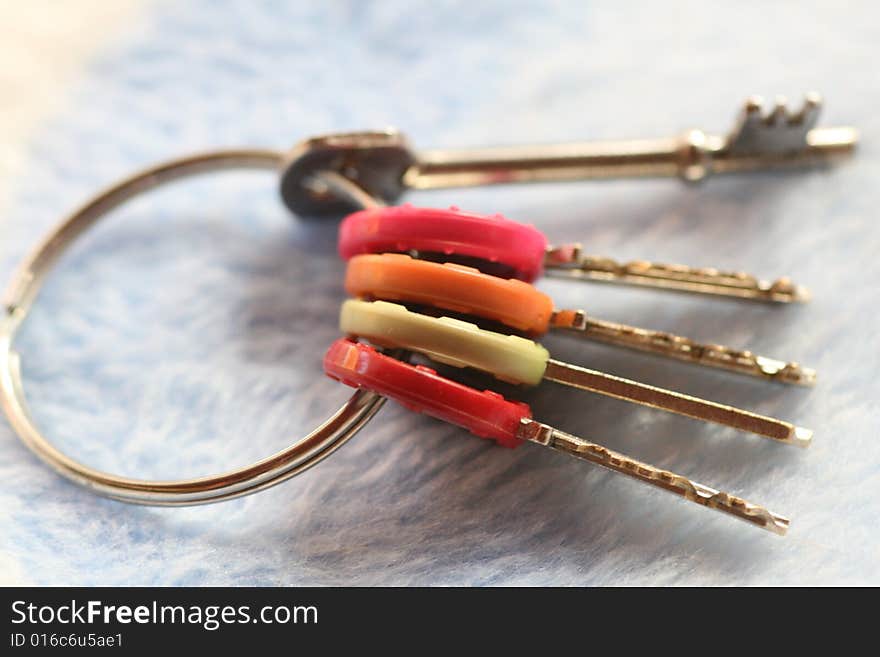 A bunch of colour coded keys on a keyring. A bunch of colour coded keys on a keyring