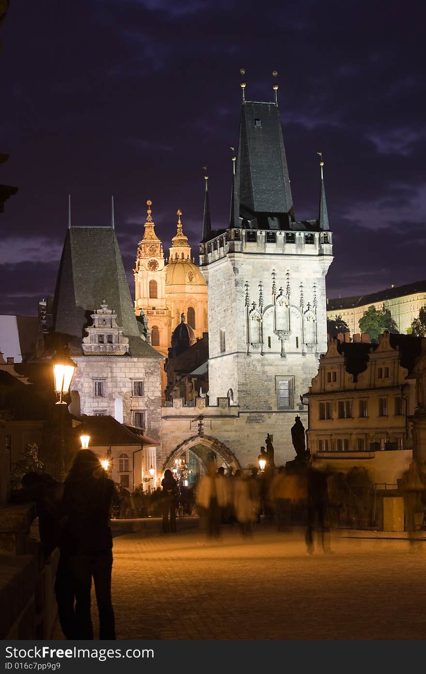 Charles bridge, tower bridges and St. Nicholas church in sunset. Charles bridge, tower bridges and St. Nicholas church in sunset.