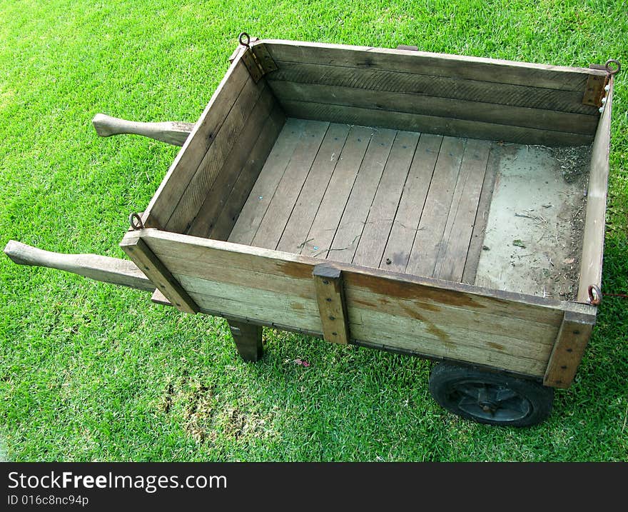 Antique farm wagon in a hayfield on a summer day. Antique farm wagon in a hayfield on a summer day