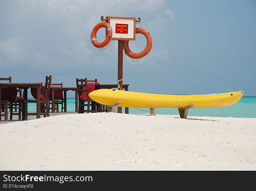 A kayak on the beach of a Maldivian resort.