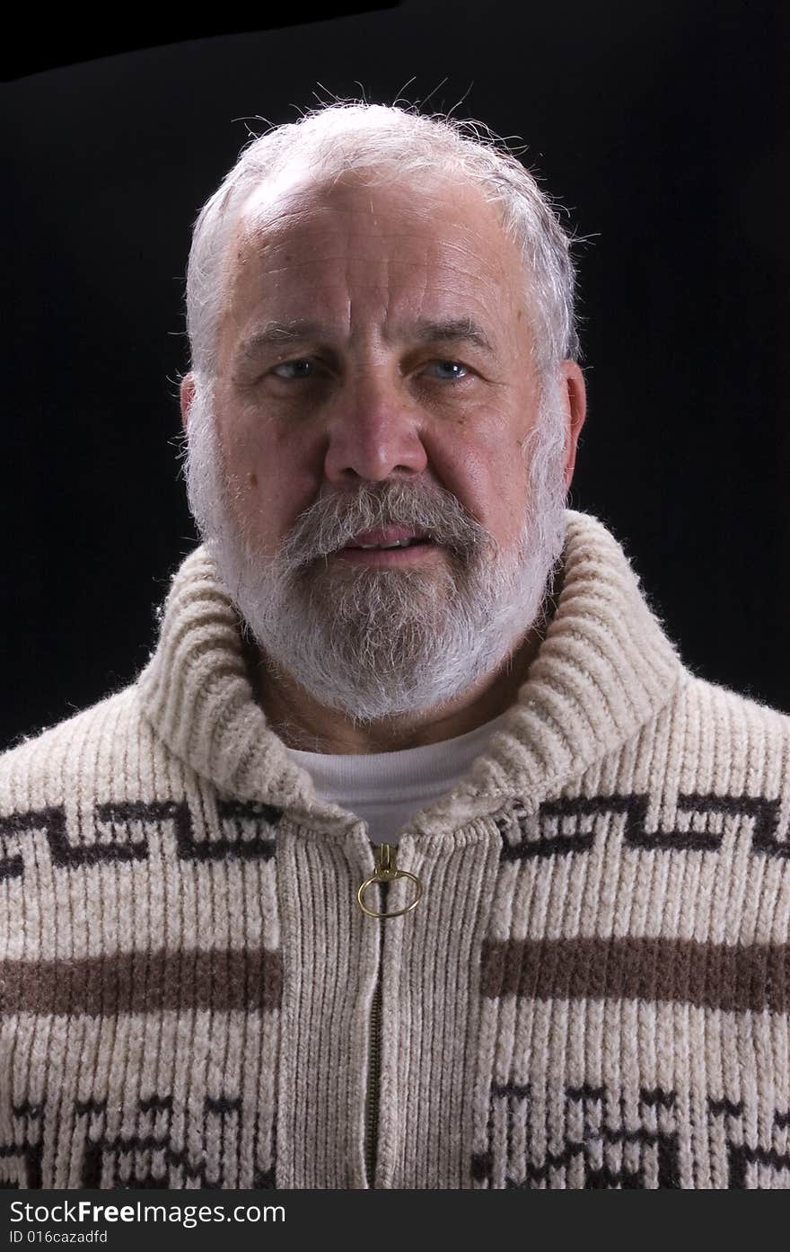 Bearded man in sweater modeling in Hemingway fashion. Bearded man in sweater modeling in Hemingway fashion