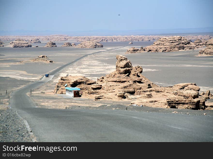 Yadan landforms- The world Geologic Garden on the Desert which is the lmmense in Scale. the most perfect in their shapes and the richest in intension in the world.
 gobi desert  road Dunhuang gansu china