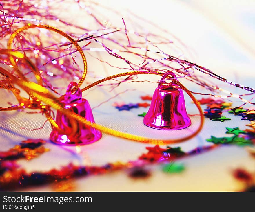 Christmas hand bells with a tinsel and shine