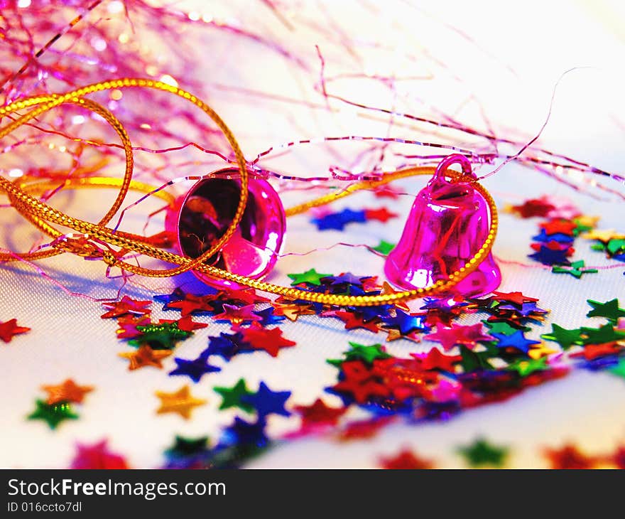 Christmas hand bells with a tinsel and shine