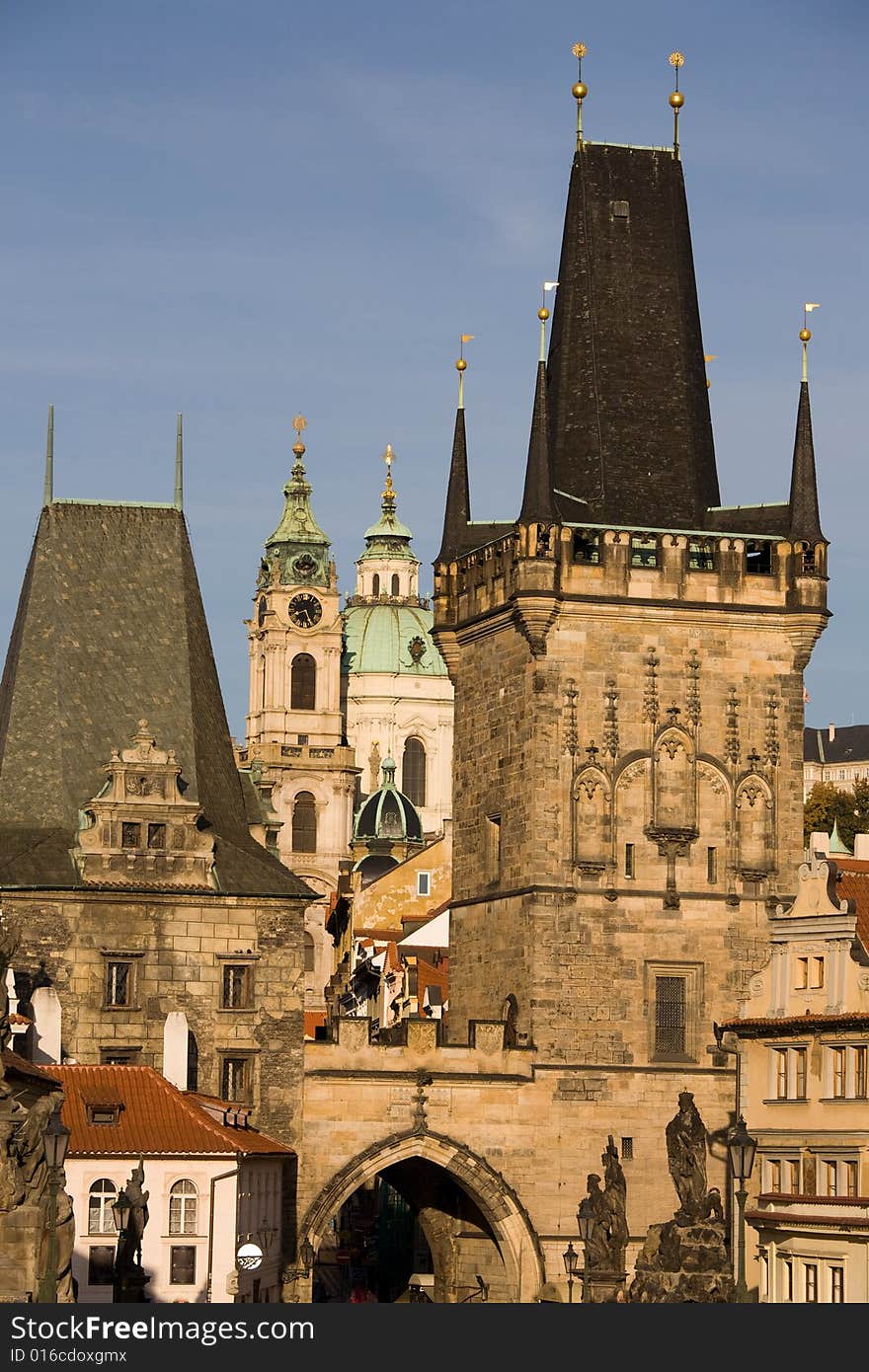 Prague day-view to Charles bridge towers and st. Nicholas church in the background. Prague day-view to Charles bridge towers and st. Nicholas church in the background.