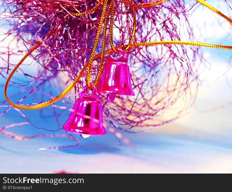 Christmas hand bells with a tinsel and shine