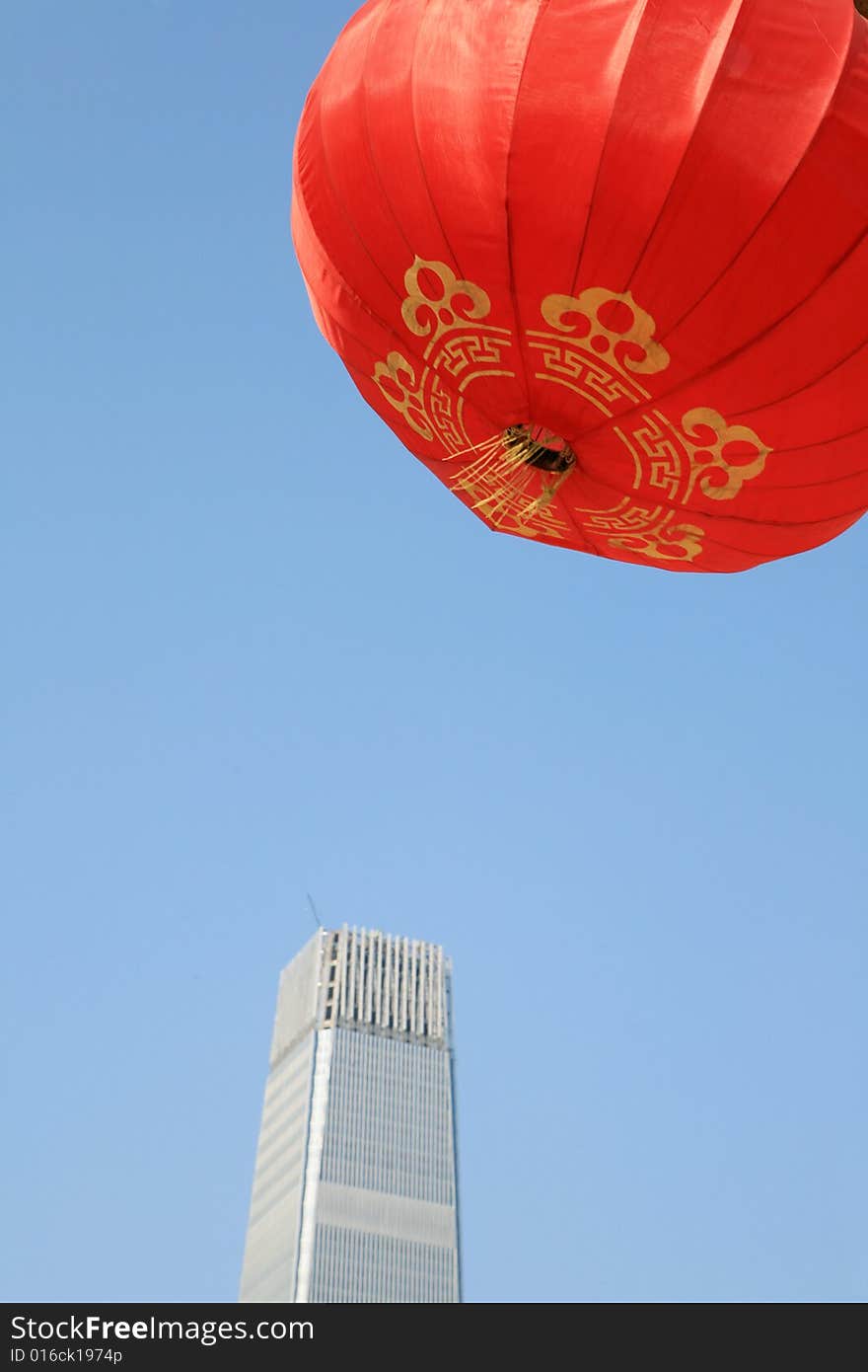 Red lantern and  skyscraper with blue sky in Beijing CBD(Central Business District),China. tradition   VS modern. Red lantern and  skyscraper with blue sky in Beijing CBD(Central Business District),China. tradition   VS modern