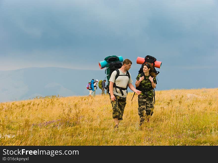 Backpackers hike in Crimea mountains. Backpackers hike in Crimea mountains