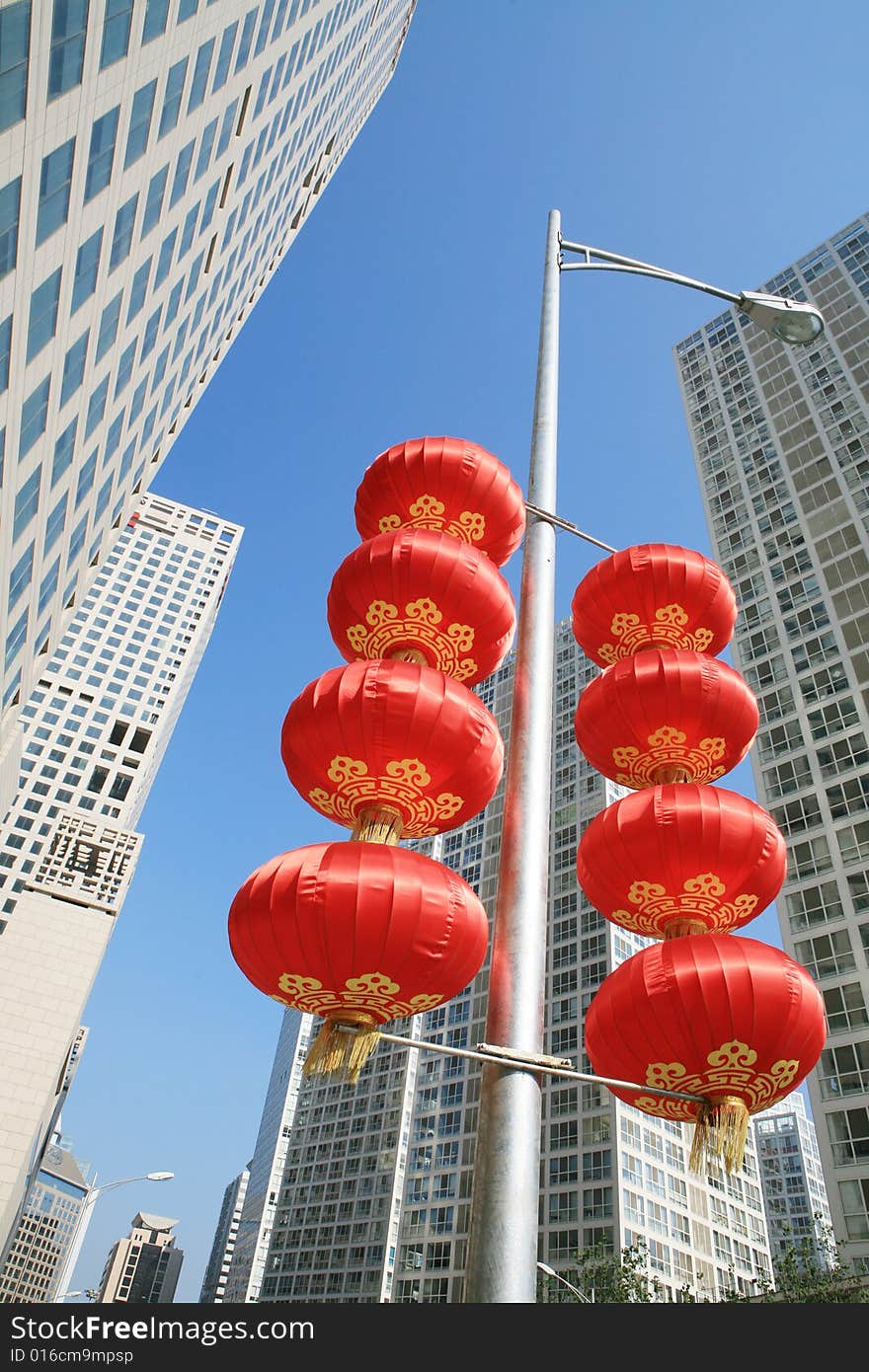 Red lantern and  skyscraper with blue sky in Beijing CBD(Central Business District),China. tradition   VS modern. Red lantern and  skyscraper with blue sky in Beijing CBD(Central Business District),China. tradition   VS modern