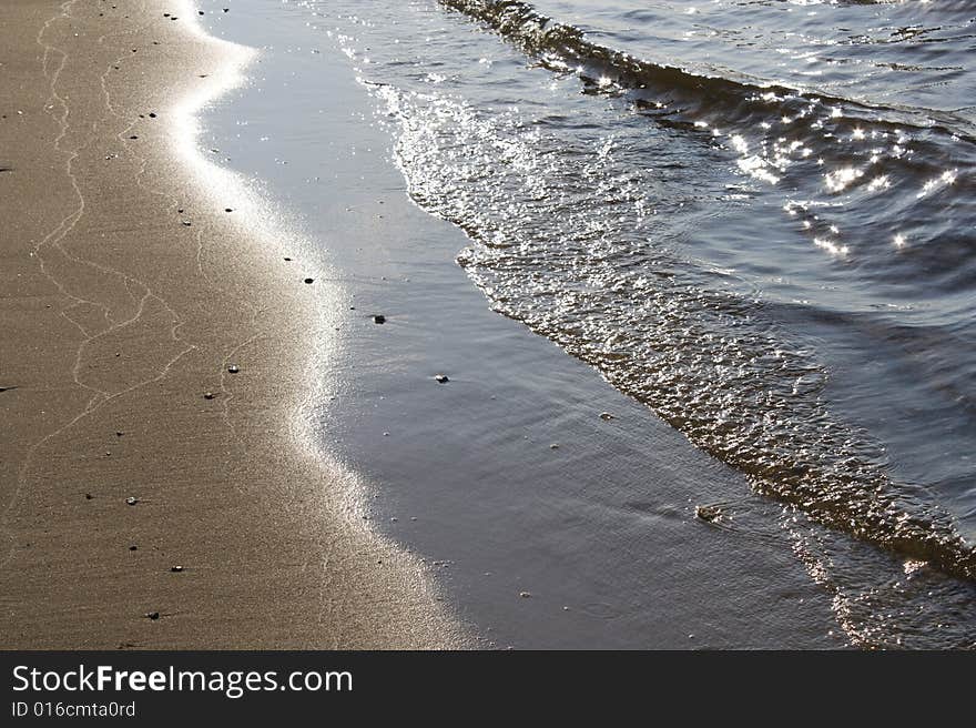 Picture of beach (sand and waves)