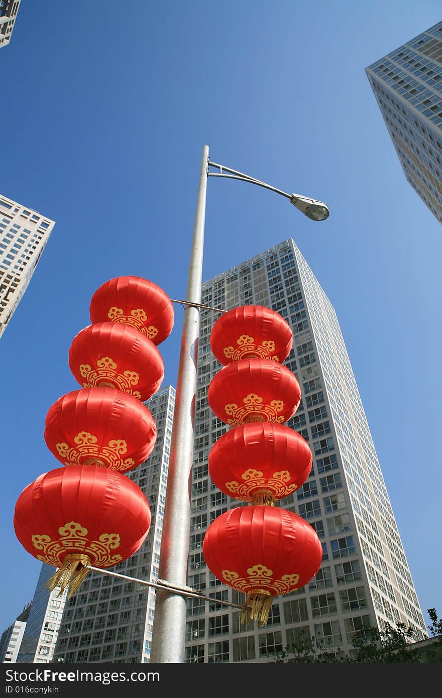 Red lantern and  skyscraper with blue sky in Beijing CBD(Central Business District),China. tradition   VS modern. Red lantern and  skyscraper with blue sky in Beijing CBD(Central Business District),China. tradition   VS modern