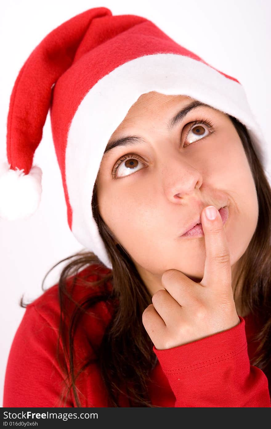 Beautiful young woman with red christmas hat