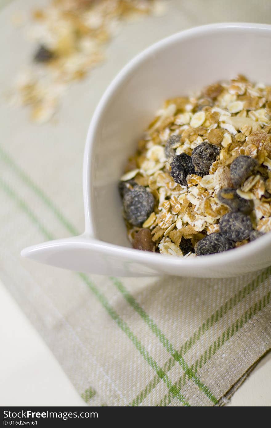 Bowl full of musli and bottle of milk