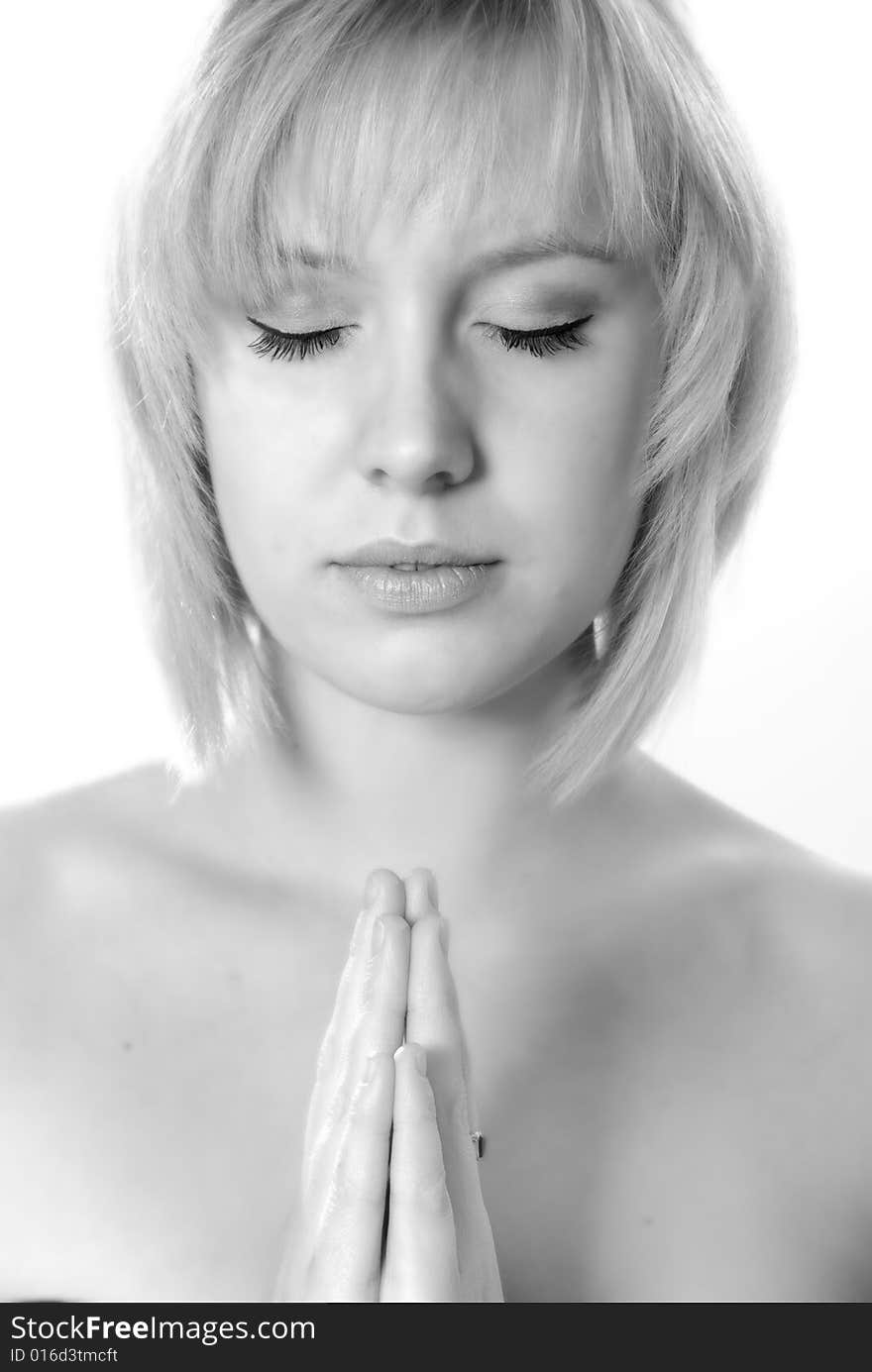 Angelic young woman praying