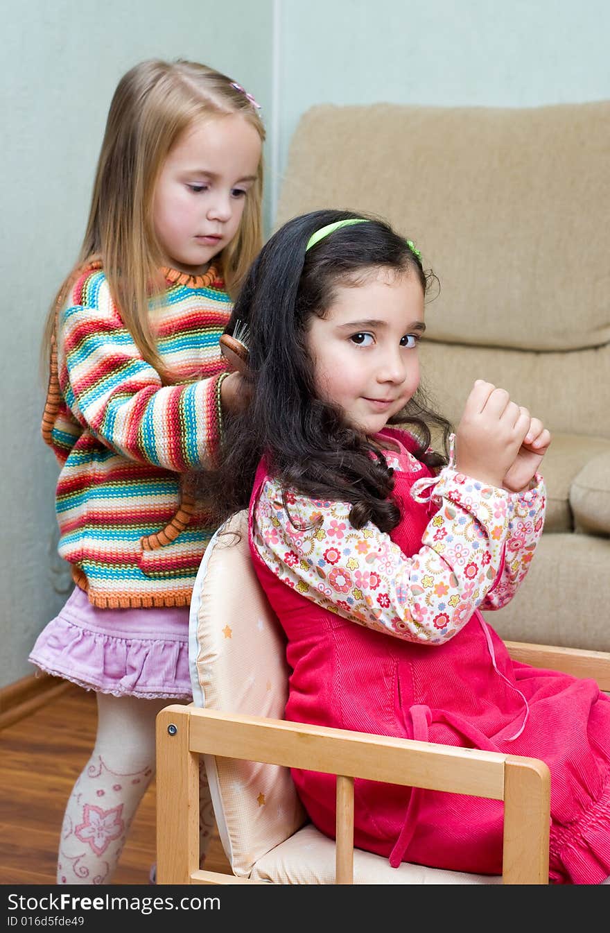 Two cute little 3 years old girls playing. Two cute little 3 years old girls playing